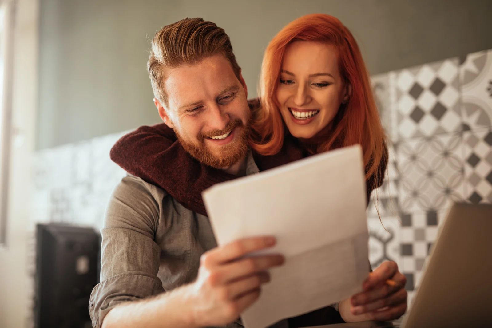 A couple enjoying time online together at home